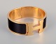 Hermes, 
Frankrig.
Clic Clac H 
armbånd. 
Guldpatineret 
metal og 
emalje.
Original æske 
og ...