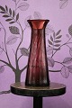 Antikt 
mundblæst 
hyacintglas fra 
Holmegaard i 
smuk violet 
farve.
H:21cm. Dia.: 
8cm.