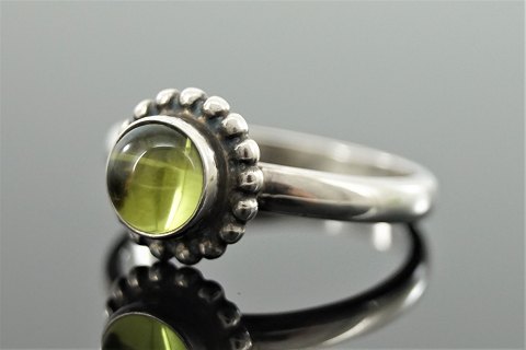 Georg Jensen; A ring of sterling silver set with a peridot #9B