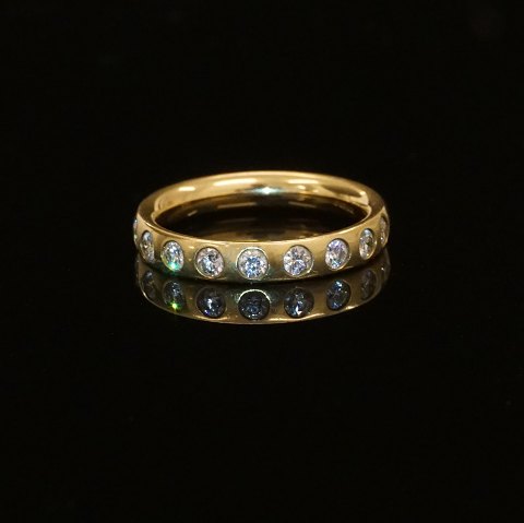 Georg Jensen: An 18kt gold ring with nine 
diamonds. Ringsize 55
