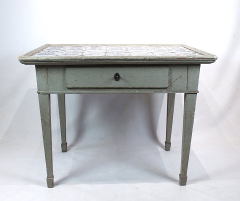 Grey painted danish tile table from the 1780s with dutch tiles.
5000m2 showroom.
