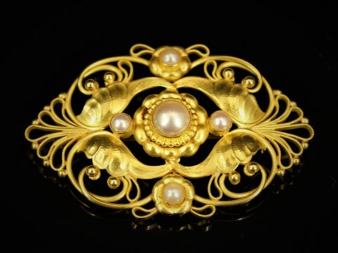Georg Jensen; A 18k gold brooch set with pearls #19