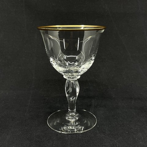 Viol with golden edges clear white wine glass