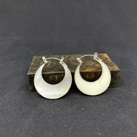 A pair of modern earrings with mother of pearl