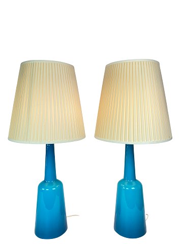 A pair of table lamps of blue opaline glass manufactured by Kastrup Glass 
Factory from around the 1950s. 
5000m2 showroom.
Great condition
