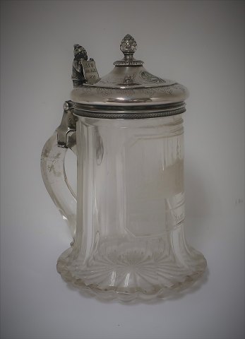 Beer mug. Glass mug with silver lid. Height 18 cm. With engraving from 1859. 
With Masonic sign.