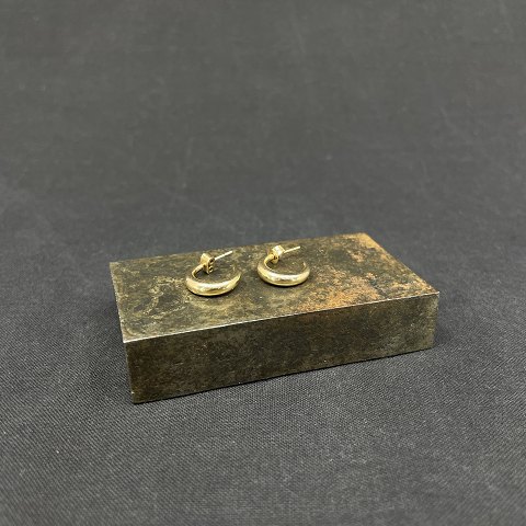 A pair of gold ear studs