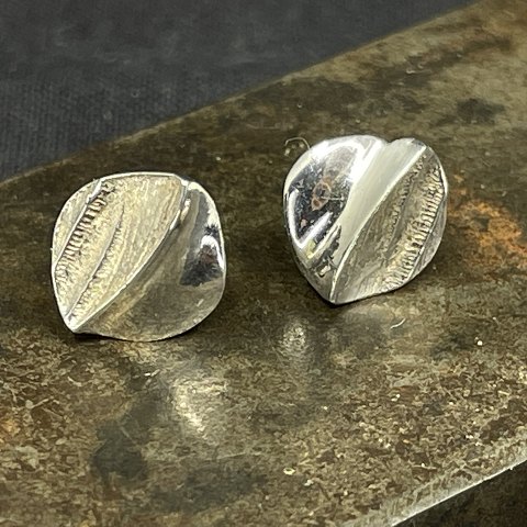 A pair of modern silver ear studs