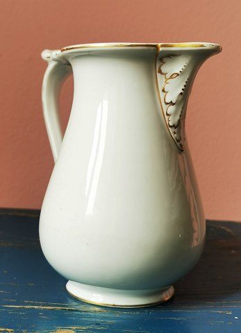 Royal Copenhagen: Jug in white porcelain with bisquit decorations 19th Century