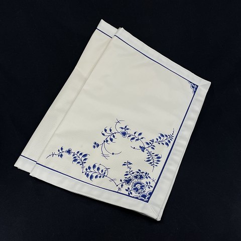 A pair of blue fluted placemats in fabric