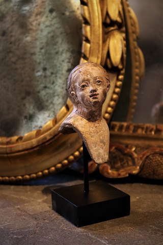 Small decorative terracotta bust from the 1700s / 1800s with old painting and 
glass eyes...