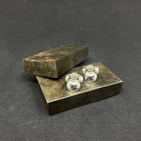 A pair of ear clips by N. E. From