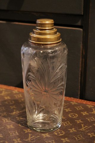 Nice old cocktail shaker in glass with beautiful floral cuts 
and brass top...