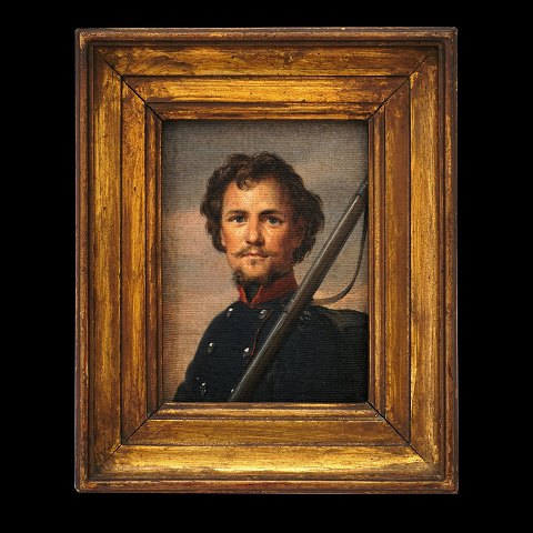 Portræt af ung dansk landsoldat poserende med 
gevær ca. år 1848. Lysmål: 17x13cm. Med ramme: 
27x23cm