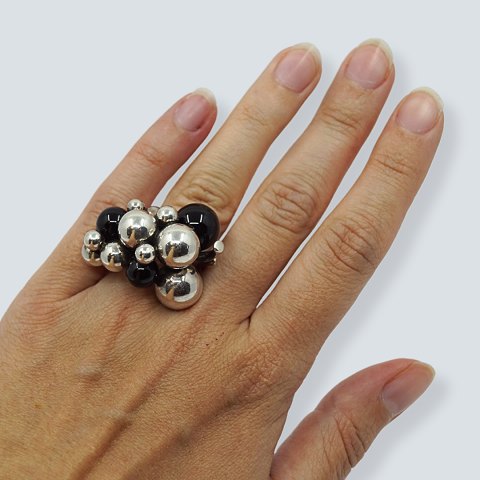 Georg Jensen; A Moonlight Grapes ring of sterling silver set with onyx