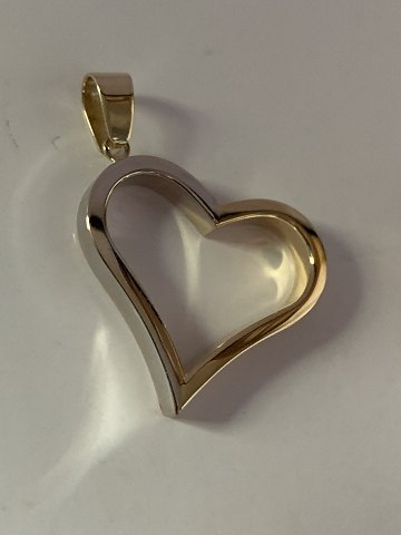 Heart-shaped pendant in 14 carat red and white gold, stamped 585 SE