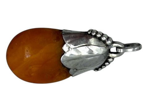Large amber pendant with silver mounting