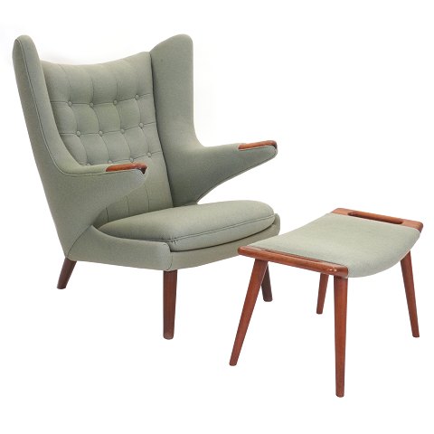 Hans J. Wegner “Papa Bear”. Wingback teak easy chair with matching stool. AP 19 and AP 29