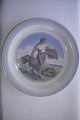 Royal 
Copenhagen 
porcelæn, Fad / 
askebæger med 
motiv af kvinde 
med neg, 
diameter 18 cm. 
Fin hel ...