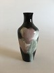 Rørstrand Art 
Nouveau Vase 
unika af 
Karl-Emil 
Lindstrøm. 
Måler 16cm og 
har en 
reparation på 
randen.
