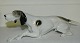 Porcelænsfigur 
af liggende 
hund - pointer 
- fra Metzler & 
Ortloff, 
Tyskland. 
Fremstillet 
midt ...