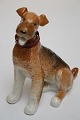 Rusisk figur, 
Ayerdale 
Terrier. Længde 
15 cm. Højde 
17,5 cm. Pris: 
525  kr.