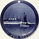 Royal 
Copenhagen 
juleplatte 
1935, designet
af Chr. 
Benjamin Olsen, 
har titlen 
Fiskekutter 
syd ...