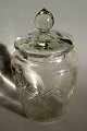 Kiksespand i 
klart glas med 
l&aring;g, o. 
1900, Danmark. 
Med stjerne 
slibninger 
p&aring; 
korpus. ...