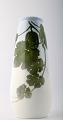 Royal 
Copenhagen vase 
dekoreret med 
vandmelonplante.
 Måler 27cm. x 
16 cm. 2. 
sortering, i 
...