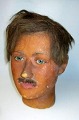 Voks mannequin, 
o. 1918, en ung 
mand med 
oversk&aelig;g. 
H.: 27 cm. Med 
glas&oslash;jne 
og ...