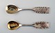 2 Sami/Lapps spoons in silver. Motif of moose and man in national costume.