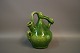 Keramik i grøn 
glasur fra 
1960erne af en 
ukendt 
keramiker. 
H: 20 cm og B: 
15 cm.