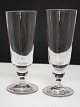 Høje porterglas 
med knop under 
kummen. Kan 
også bruges som 
champagneglas.
Højde 17,5 cm. 
...