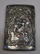 Match holder in 
silver, 
Netherlands. 
20th century. 
The rococo 
decorations of 
dancing and 
smoking ...