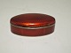 Enamel pill 
box. Norwegian. 
Red enamel. 
Length 6 cm. 
Small chip on 
the edge of the 
lid.