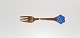 A.Michelsen 
Christmas fork 
in gold-plated 
sterling silver 
and enamel from 
1976 
Stamp: ...
