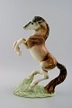 Large Goldschneider figure in porcelain, rearing horse.
