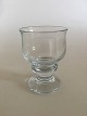 "Tivoli" 
Holmegaard 
Hvidvinsglas. 
Måler 10,5 cm 
Højt. Design: 
Per Lütken.
