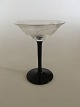 "Jane" Sortfods 
Likørglas med 
drueslibning. 
Holmegaard. 
10.5 cm H. 8 cm 
diameter. 
Produceret ...
