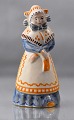 Figur i 
glaseret 
keramik med 
motiv af kvinde 
i blå egnsdragt
Design af L. 
Hjort
Keramik, ...