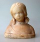 Ubekendt kunstner (20. årh. ).Portræt buste af lille pige med fletninger, ca.1900. Hvidlig ...