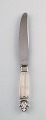 5 Georg Jensen 
Dronning 
Sterling Sølv, 
middagsknive 
med kort skaft. 

Måler 23 cm.
Stemplet. ...