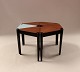 The coffee 
table, 
consisting of 6 
triangular side 
tables in teak 
and blue 
lacquered wood 
with ...