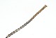 Columbine 
Armbånd med 
skaveringer, 14 
Karat Guld
Stemplet: 
585,EHS
Længde 20,5 
cm. 
Bredde ...