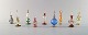 Stor samling af 
italienske 
flakoner i 
mundblæst 
kunstglas. 
Delvist farvet 
glas dekoreret 
med ...