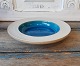 Niels Kähler 
bowl with blue 
glaze 
Signed: HAK - 
No. 153-23
Height 4 cm. 
Diameter 24 cm.