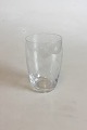 Holmegaard 
Kronborg 
Vandglas. 
Designet af 
Jacob Bang. 
Måler 11,7 cm