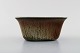 Gunnar Nylund 
for Rörstrand / 
Rørstrand. Bowl 
in glazed 
ceramics. Glaze 
in light brown 
and green ...