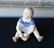 Figur i 
porcelæn med 
motiv af pigen 
Ruth siddende 
med spand og 
skovl. Nr. 2313
Design af 
Svend ...