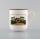 Villeroy & Boch Naif porcelain cup decorated with naivist village motif.